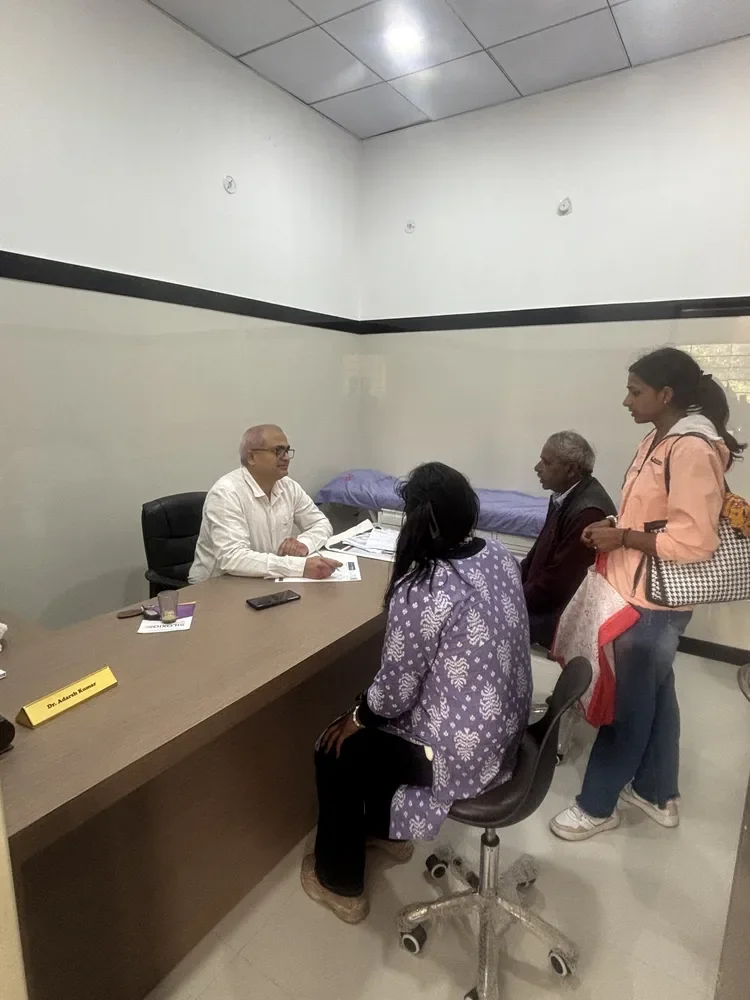 Dr. Adarsh Kumar consulting with family members
