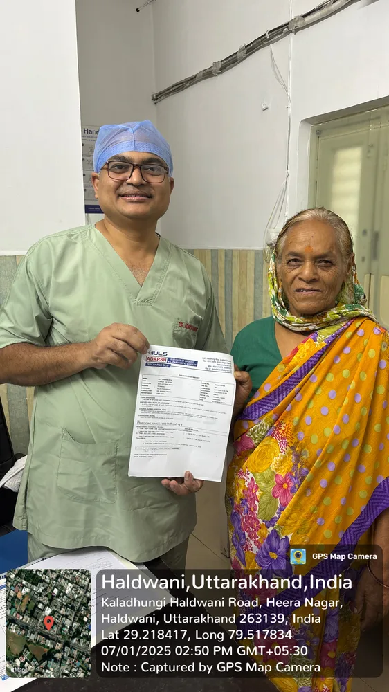 Dr. Adarsh Kumar bedside checkup with elderly patient